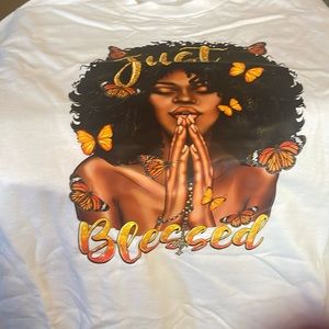 A white, medium, Christian just blessed t-shirt.